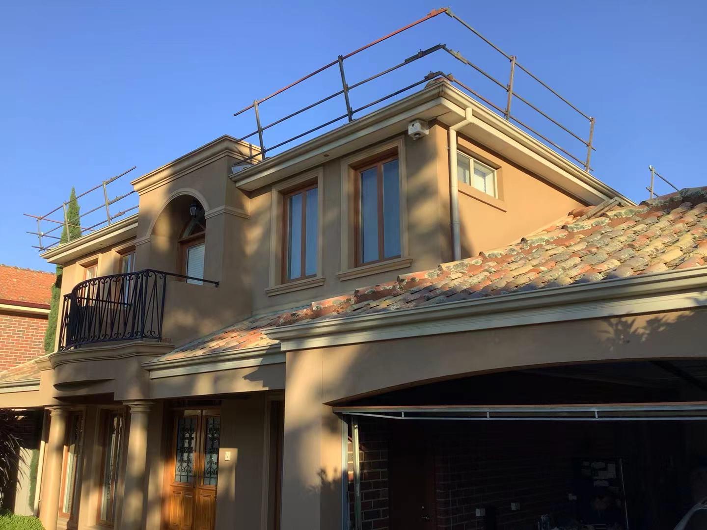 Restored tile roof at sunset